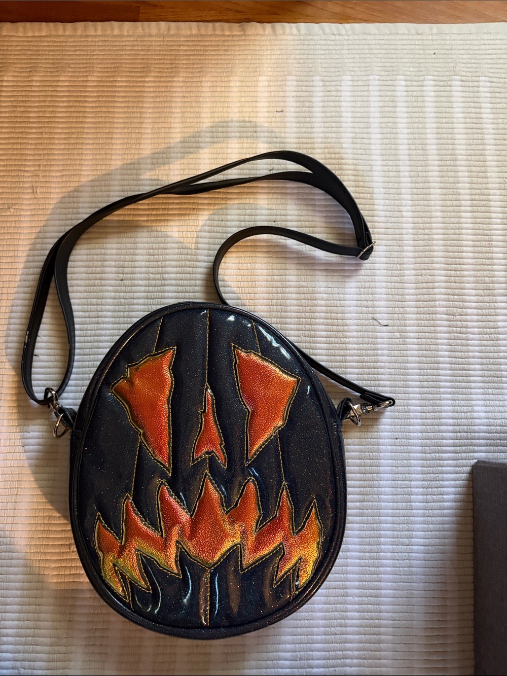 Black Round Crossbody Bag with Orange Flame Design love pain stitches